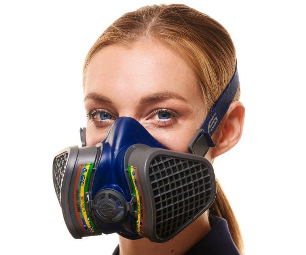 Close-up of a woman wearing a blue GVS respiratory mask with black filters