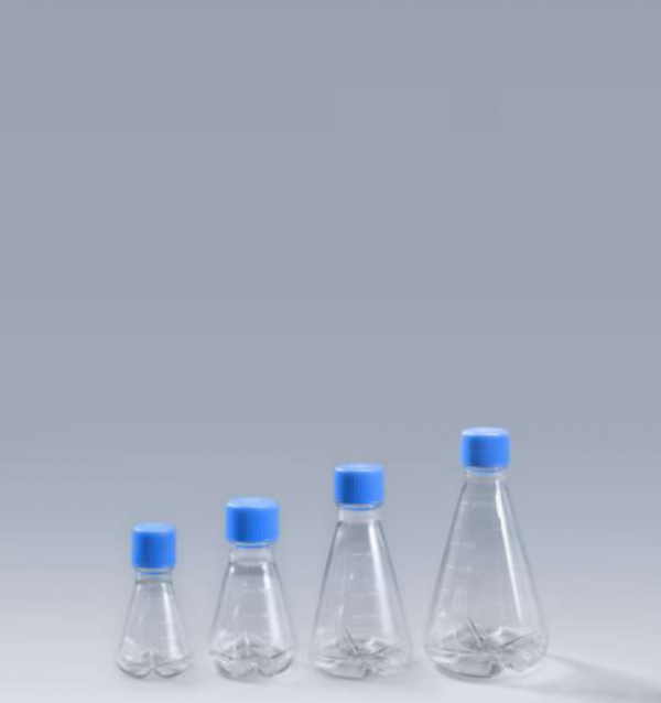 Four clear plastic bottles with blue caps used for laboratory purposes.