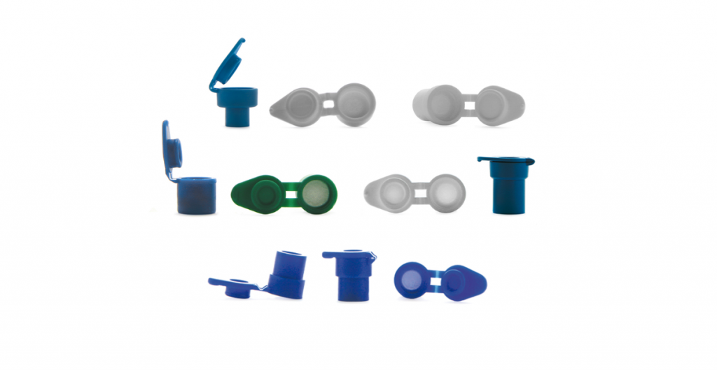 Various syringe filters in different colors on a white background.