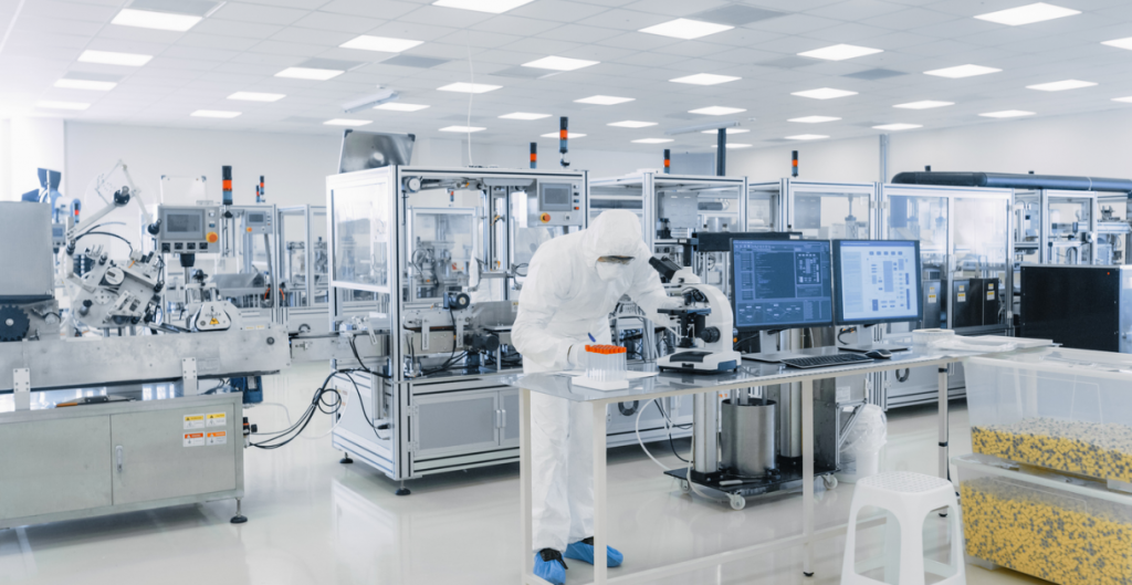 Scientist in protective gear working in a laboratory, testing bacterial filters.