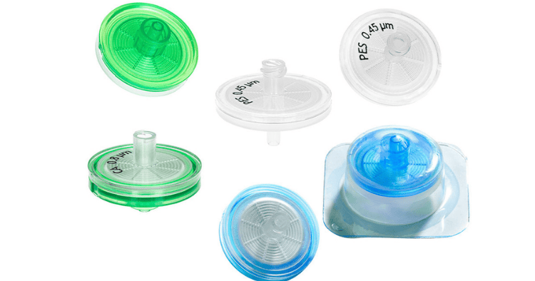 Various GVS syringe filters in green, blue, and clear designs, used for precise laboratory filtration.