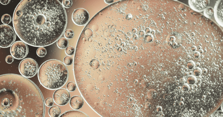 Close-up of microscopic bubbles in liquid, illustrating the filtration efficiency of GVS bacterial filters.